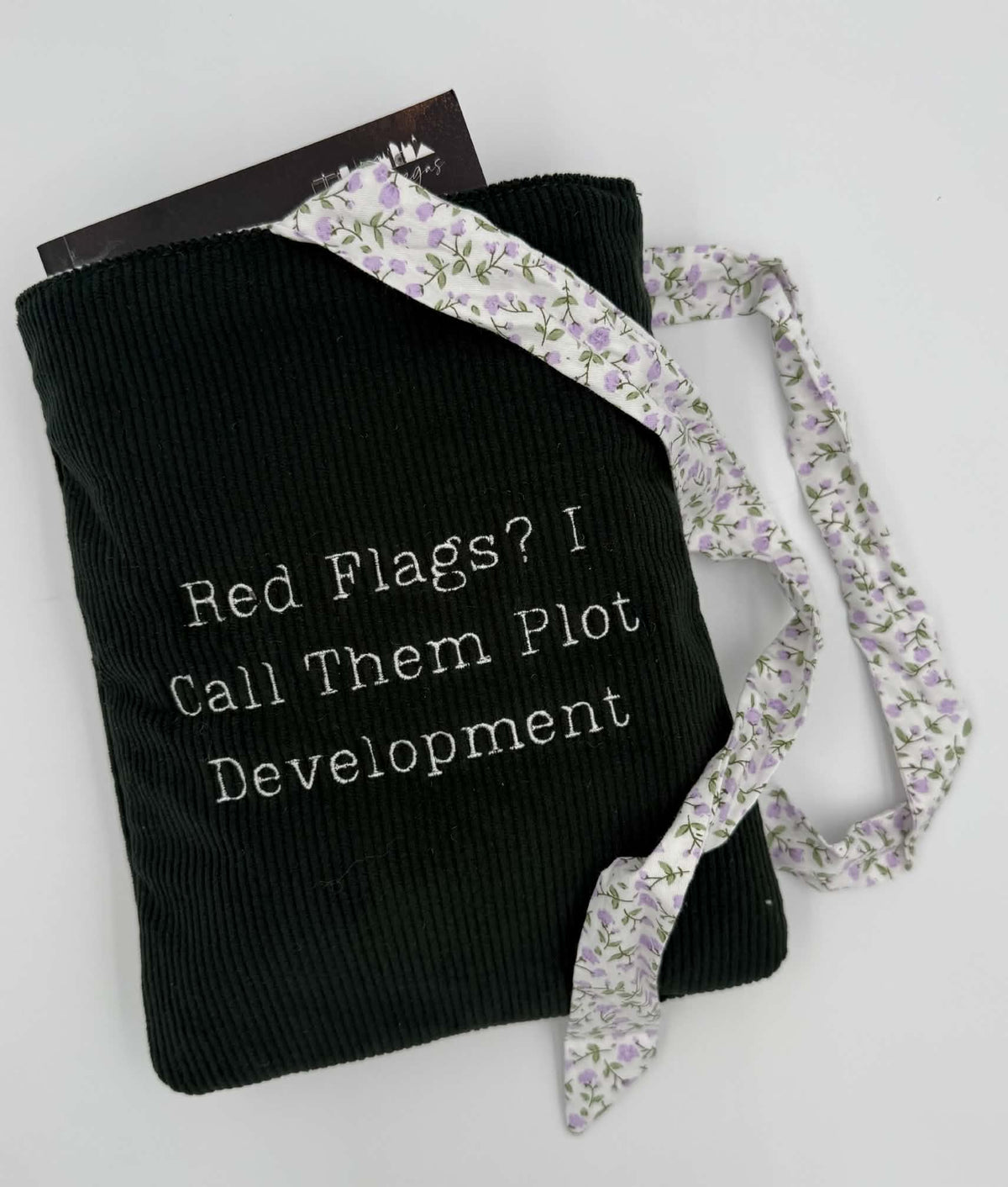 Red Flags? I Call Them Plot Development Book Sleeve – Black Corduroy with Lilac Floral Bow